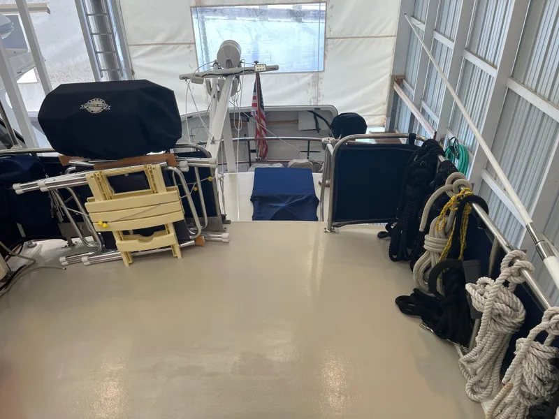 Slide: The Image of Interior view of 1969 Grand Banks 36 Classic boat with ropes and seating. - 7