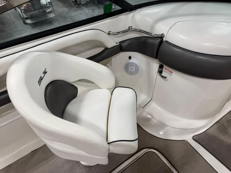 Slide: The Image of Luxury seating in 2006 Sea Ray 290 SLX boat interior, featuring white and black upholstery. - 11