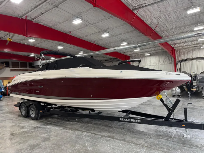 Slide: The Image of 2006 Sea Ray 290 SLX boat on trailer in indoor storage facility. - 14