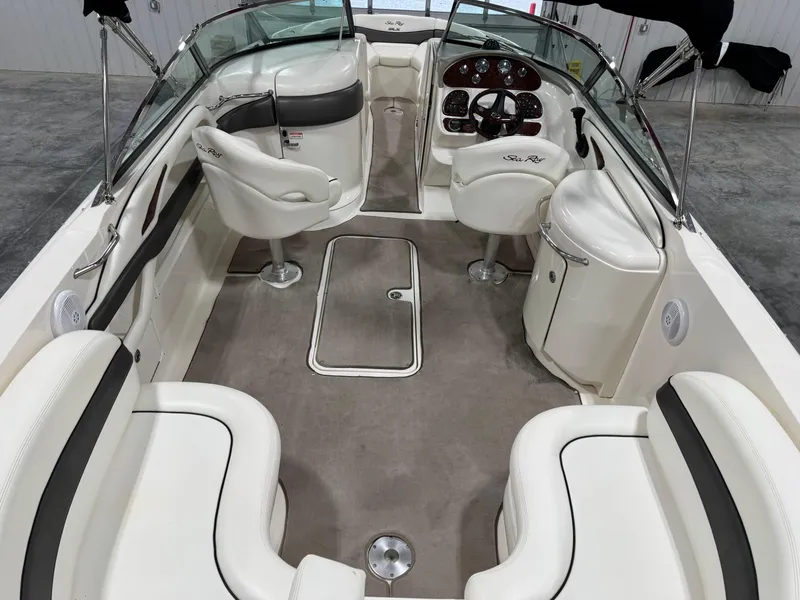Slide: The Image of Interior of a 2006 Sea Ray 290 SLX boat, featuring seating and helm controls. - 6