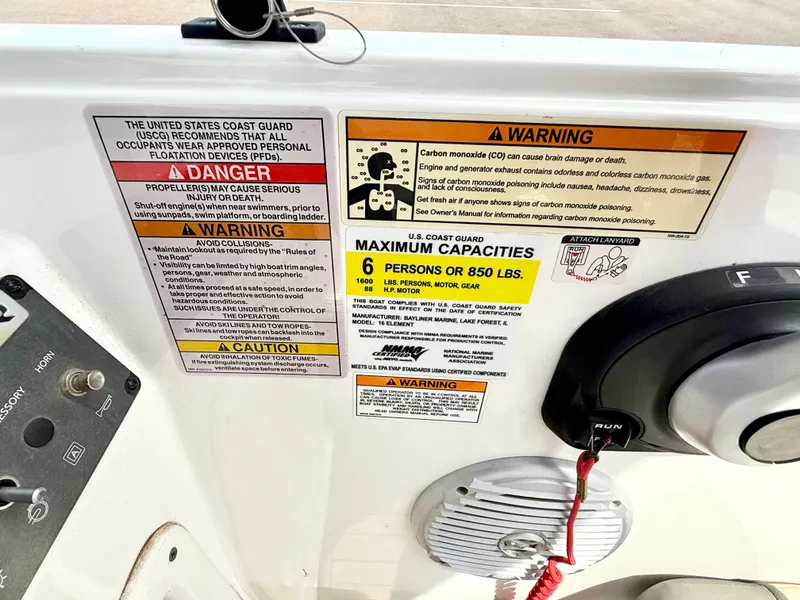 Slide: The Image of 2017 Bayliner Element E16 dashboard with safety warnings and capacity limits. - 17