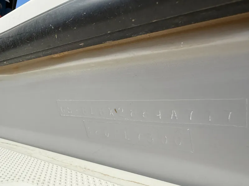 Slide: The Image of 2017 Bayliner Element E16 hull identification number on boat exterior. - 19