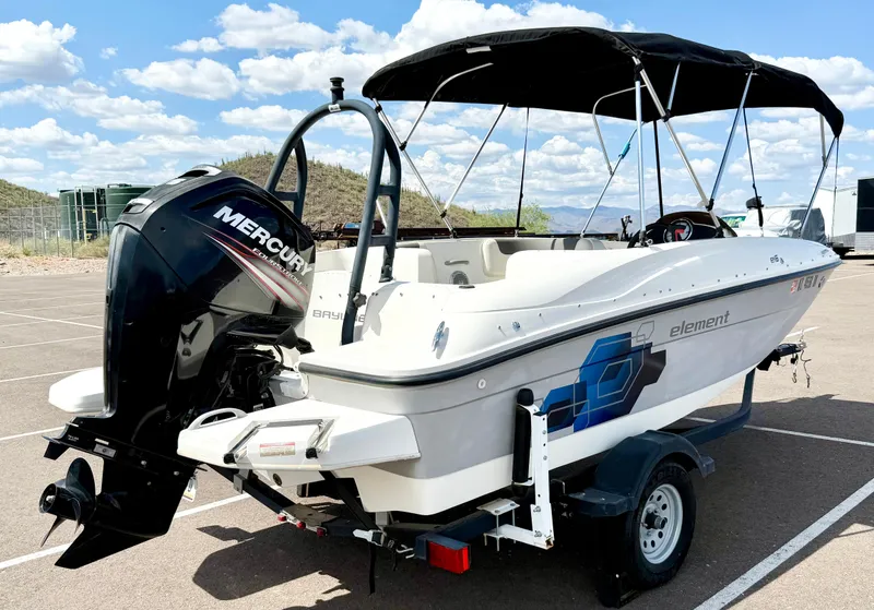Slide: The Image of 2017 Bayliner Element E16 boat with Mercury outboard motor on a trailer. - 5