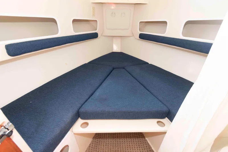 Slide: The Image of 2006 Rosborough RF-246 Sedan Cruiser interior with blue cushioned seating. - 14