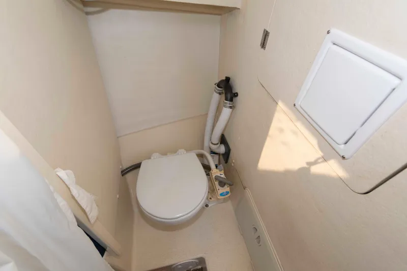 Slide: The Image of Compact bathroom in 2006 Rosborough RF-246 Sedan Cruiser boat. - 18