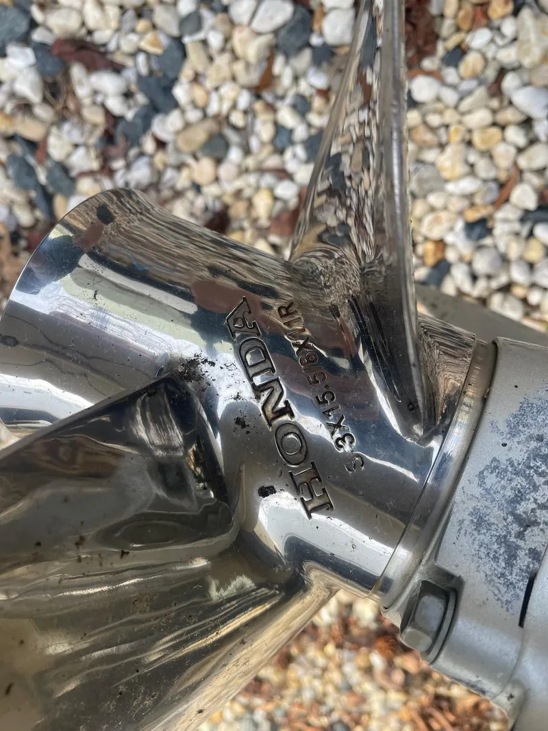 Slide: The Image of Close-up of a Honda boat propeller on a 2006 Rosborough RF-246 Sedan Cruiser. - 20