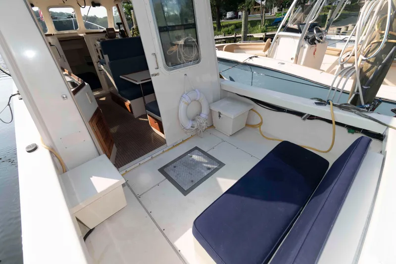 Slide: The Image of 2006 Rosborough RF-246 Sedan Cruiser interior with seating and nautical equipment. - 6