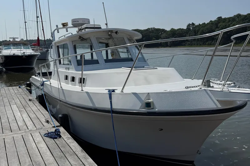 The Image of 1994 Albin 28 Tournament Express boat docked at marina, sunny day. - 1