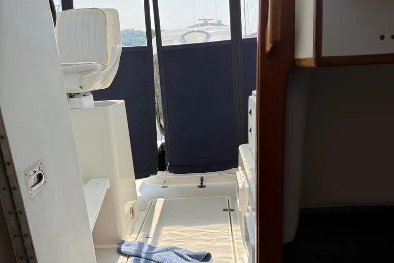 Slide: The Image of Interior of 1994 Albin 28 Tournament Express boat with seating and cabin view. - 9
