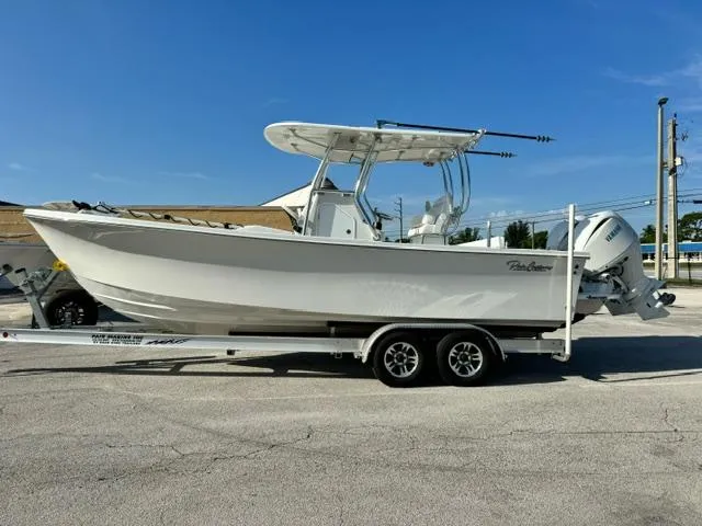 Slide: The Image of 2026 Pair Customs 24 Center Console DV boat on trailer, side view. - 1