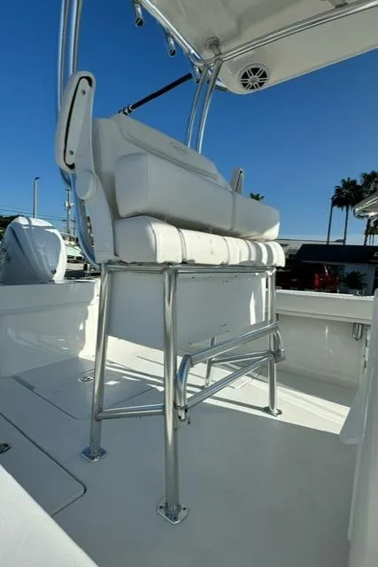 Slide: The Image of 2026 Pair Customs 24 Center Console DV boat with white seating and stainless steel frame. - 11