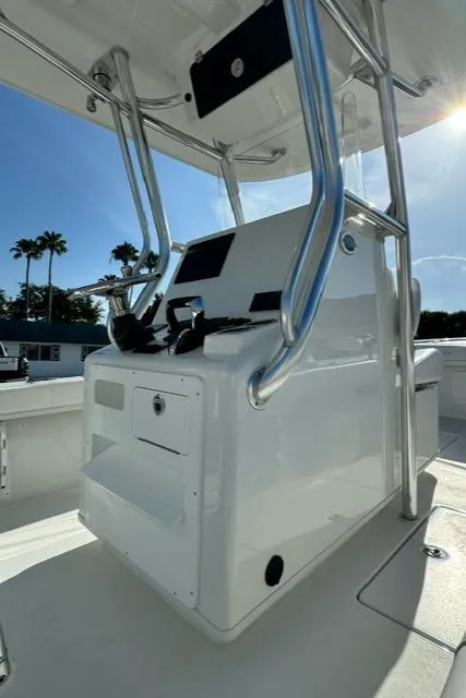 Slide: The Image of 2026 Pair Customs 24 Center Console DV boat with sleek design and modern controls. - 12