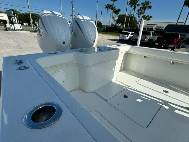 Slide: The Image of 2026 Pair Customs 24 Center Console DV boat with dual engines, sleek white design. - 8