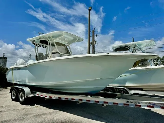 The Image of 2026 Key West 260 CC boat on trailer under blue sky. - 0