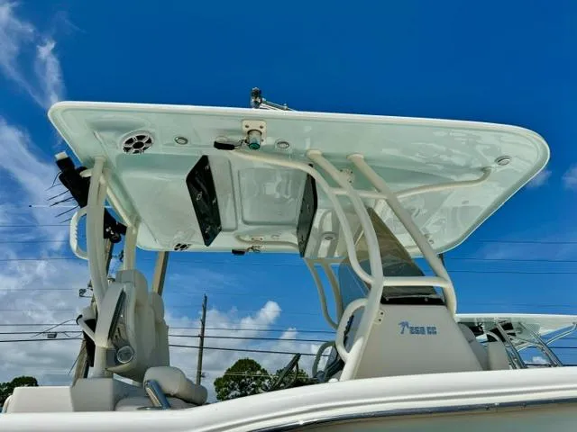 Slide: The Image of 2026 Key West 260 CC boat with T-top against a clear blue sky. - 3