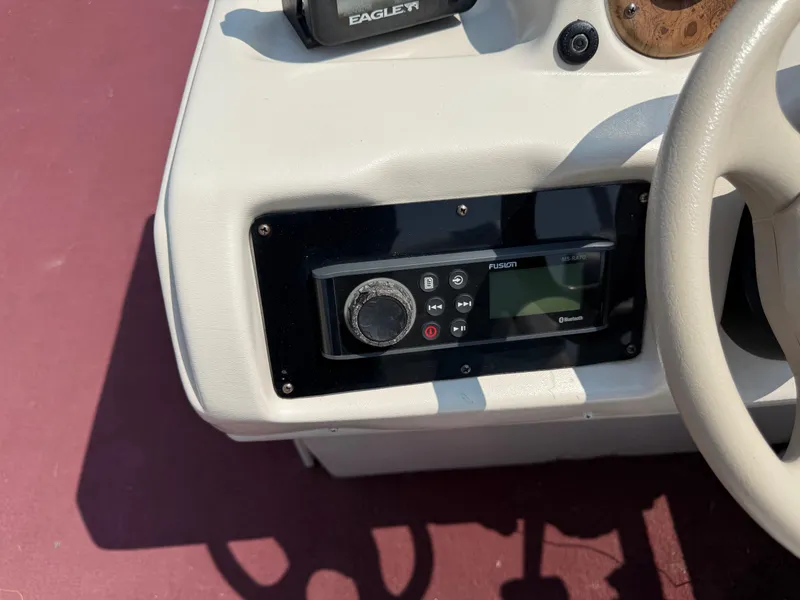 Slide: The Image of Control panel of a 1998 Sweetwater 24RE boat with Fusion audio system. - 10