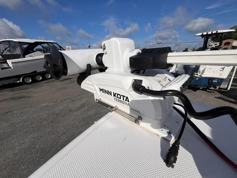 Slide: The Image of Minn Kota Terrova motor on 2017 Everglades 273 Center Console boat, parked outdoors. - 10