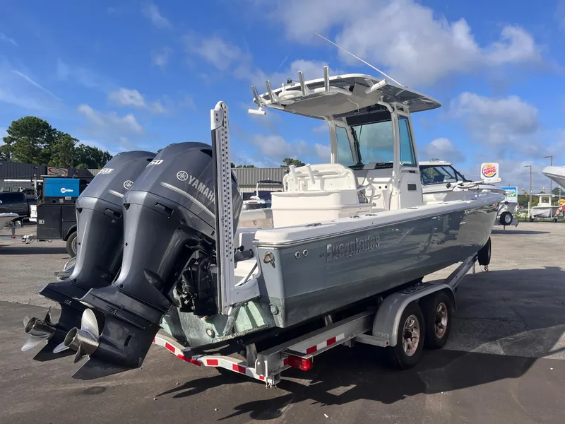 Slide: The Image of 2017 Everglades 273 Center Console boat with dual Yamaha engines on a trailer. - 4