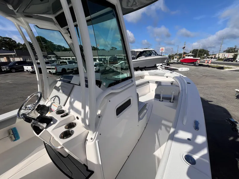 Slide: The Image of 2017 Everglades 273 Center Console boat with sleek design and modern controls. - 8