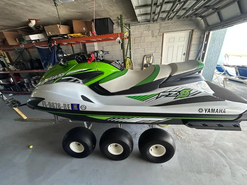 Slide: The Image of 2017 Yamaha WaveRunner FZS in a garage, green and white design, on a trailer. - 4