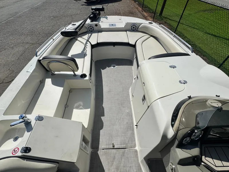Slide: The Image of 2021 Stingray 212 SC boat interior with spacious seating and modern design. - 8