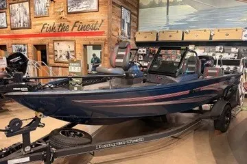 The Image of 2025 Ranger VS1782 WT fishing boat displayed indoors with rustic decor. - 0