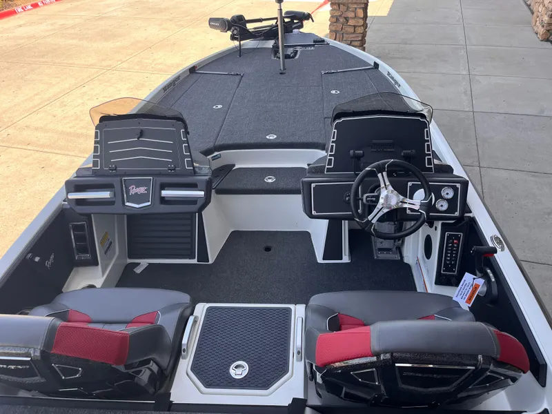 Slide: The Image of 2025 Ranger Z521 boat interior with dual consoles and steering wheel, featuring modern design and seating. - 3
