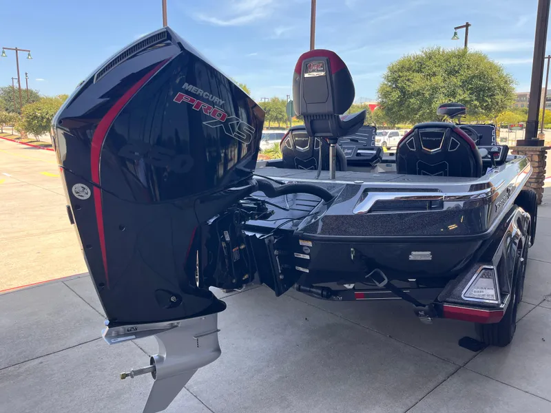 Slide: The Image of 2025 Ranger Z521 boat with Mercury Pro XS engine, parked outdoors. - 4