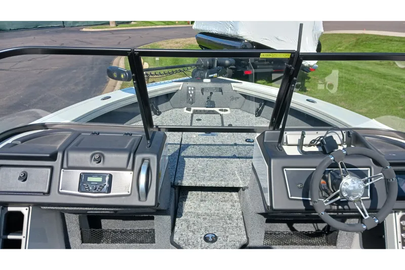 Slide: The Image of 2025 Ranger VX1988 WT boat interior with steering wheel and dashboard controls. - 6