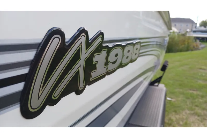 Slide: The Image of Close-up of Ranger VX1988 WT boat logo, 2025 model, with sleek design details. - 1