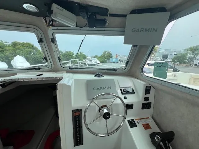Slide: The Image of Interior of 2022 Parker 2520 XLD Sport Cabin with Garmin navigation system. - 3