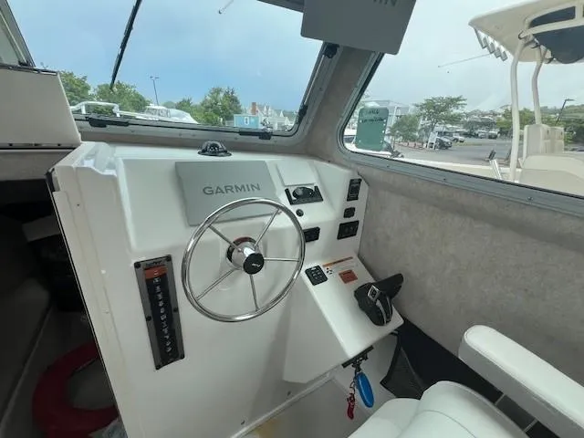 Slide: The Image of 2022 Parker 2520 XLD Sport Cabin helm with Garmin navigation system. - 6