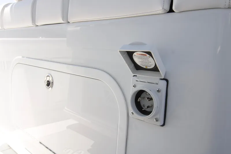 Slide: The Image of 2026 Yellowfin 36 Offshore boat with open electrical outlet on white panel. - 13