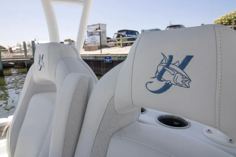 Slide: The Image of 2026 Yellowfin 36 Offshore boat seats with embroidered fish logo at marina. - 16