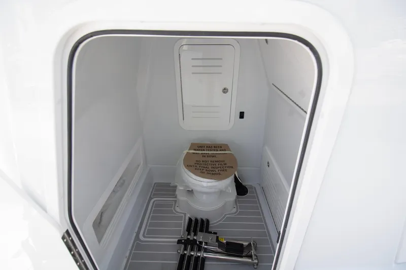 Slide: The Image of 2026 Yellowfin 36 Offshore boat interior with compact bathroom and storage space. - 20