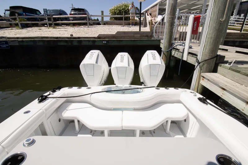 Slide: The Image of 2026 Yellowfin 36 Offshore boat with triple outboard engines docked at marina. - 23