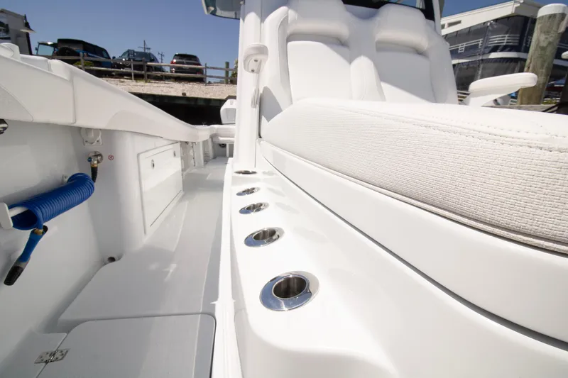 Slide: The Image of 2026 Yellowfin 36 Offshore boat interior with rod holders and seating. - 8