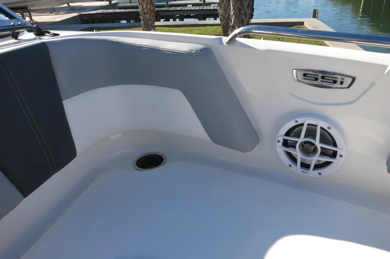 Slide: The Image of 2025 Chaparral 21 SSi Outboard boat interior with speaker and seating area. - 23