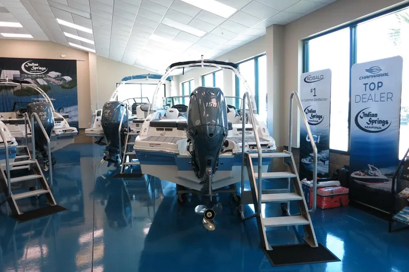 Slide: The Image of 2025 Chaparral 21 SSi Outboard boats displayed at Indian Springs Marina showroom. - 37