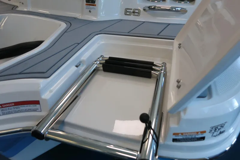 Slide: The Image of 2025 Chaparral 21 SSi Outboard boat ladder and storage compartment. - 42
