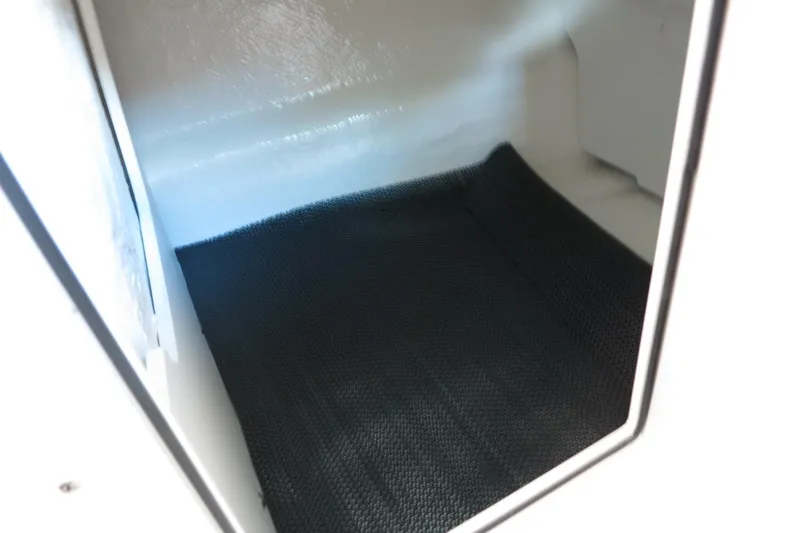 Slide: The Image of Interior storage compartment of 2025 Chaparral 21 SSi Outboard boat. - 51