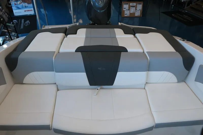 Slide: The Image of 2025 Chaparral 21 SSi Outboard boat interior with gray and white seating. - 56