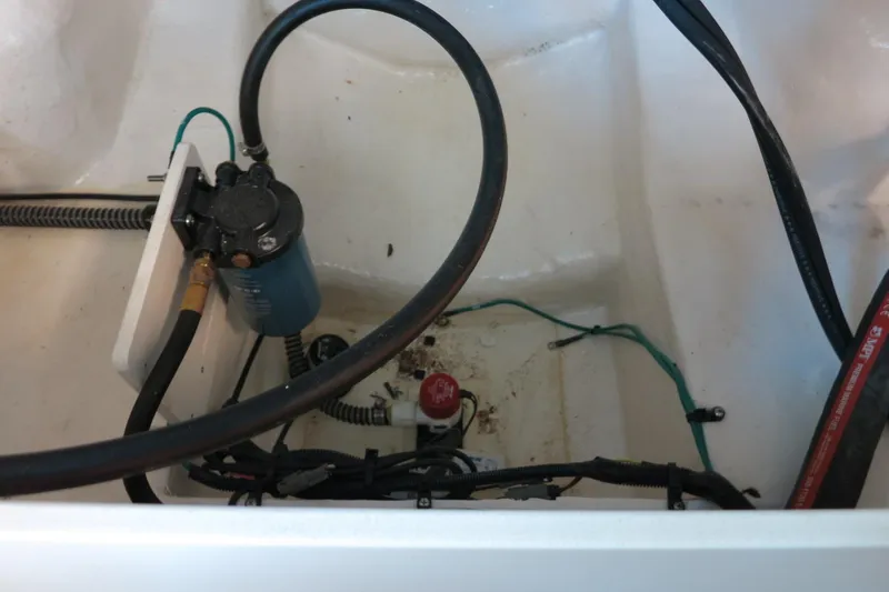 Slide: The Image of Bilge area of 2025 Chaparral 21 SSi Outboard with pump and wiring. - 62