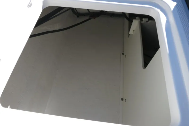 Slide: The Image of Storage compartment of 2025 Chaparral 21 SSi Outboard boat, showcasing interior space. - 8