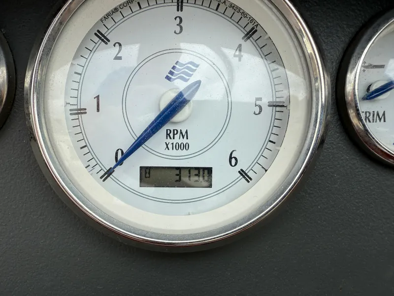 Slide: The Image of Tachometer displaying 3,120 RPM on a 2005 Four Winns Horizon 200 boat. - 11