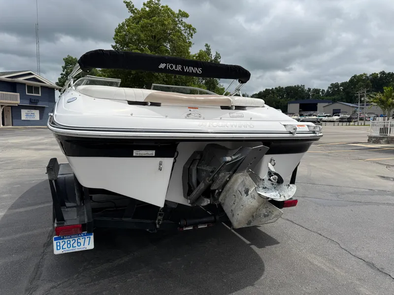Slide: The Image of 2005 Four Winns Horizon 200 boat on trailer, rear view, overcast day. - 4