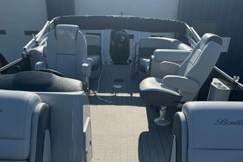 Slide: The Image of 2023 Bentley Pontoons 250 Elite Admiral interior with luxurious seating and modern design. - 4