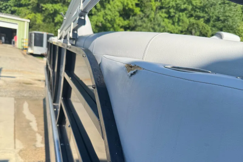 Slide: The Image of 2023 Bentley Pontoons 250 Elite Admiral with damaged upholstery detail. - 5