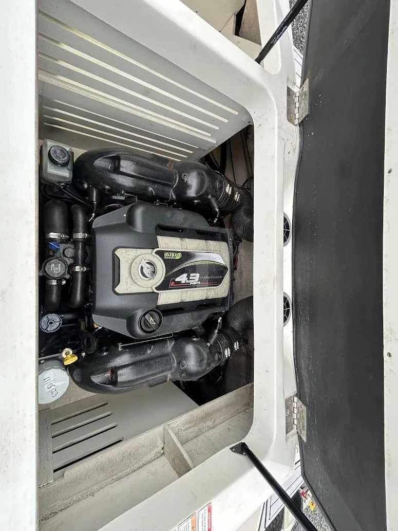 Slide: The Image of Engine compartment of a 2016 Sea Ray SPX 210 boat, featuring a 4.3L engine. - 14