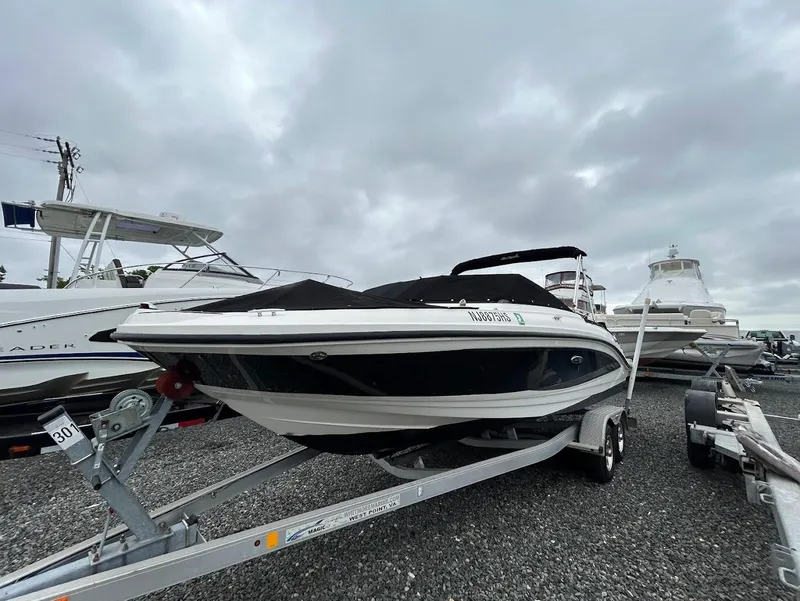 Slide: The Image of 2016 Sea Ray SPX 210 boat on trailer, overcast sky background. - 3